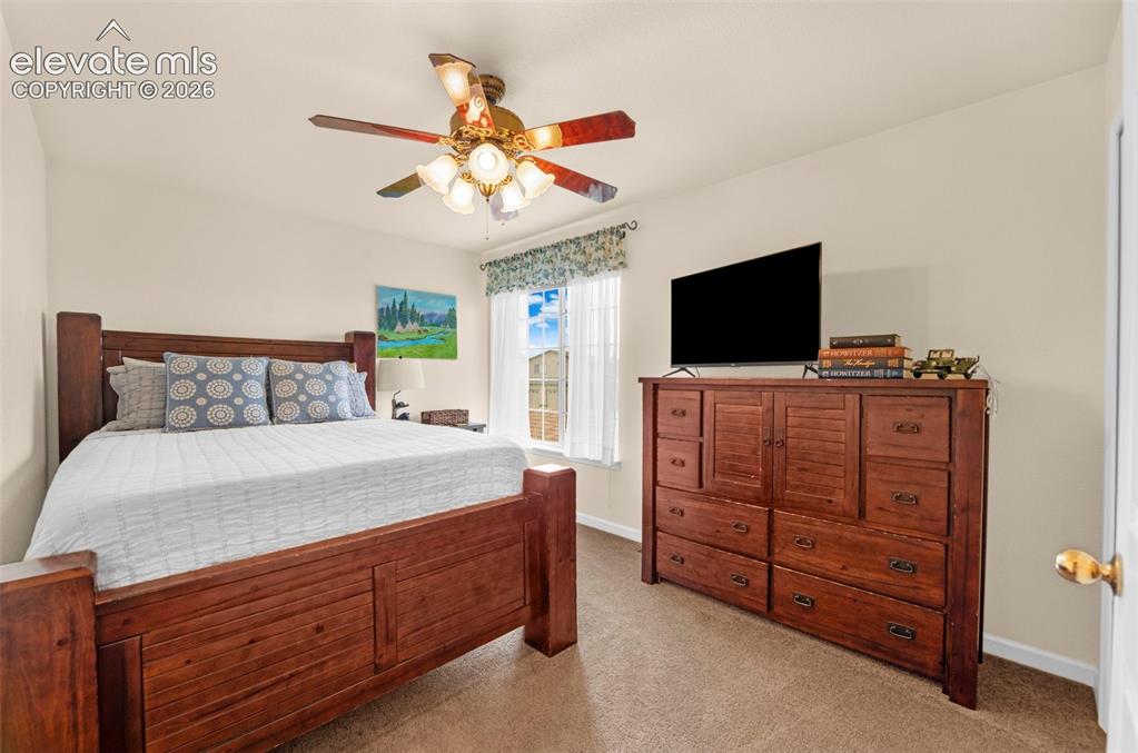 Image 25 of 41: Bedroom featuring neutral wall paint, carpet flooring, a window with blinds