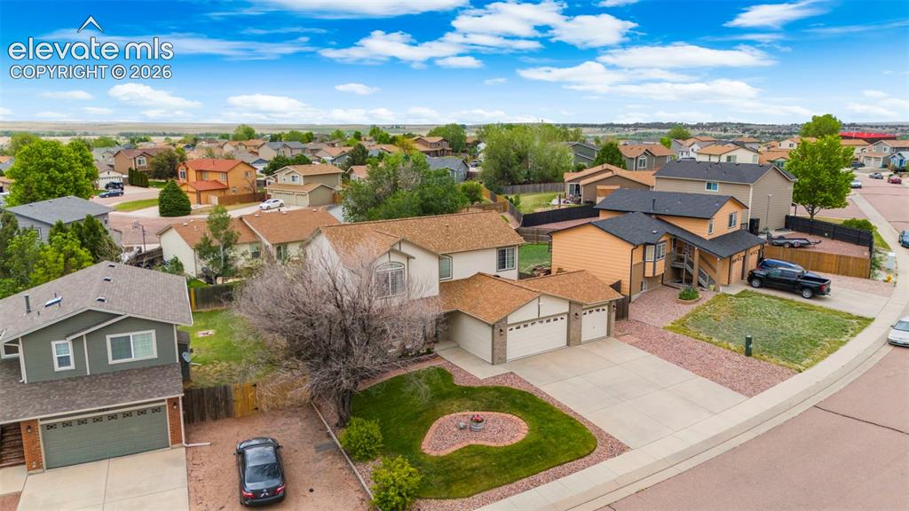 Image 33 of 41: Residential property featuring a concrete driveway, attached two-car garage