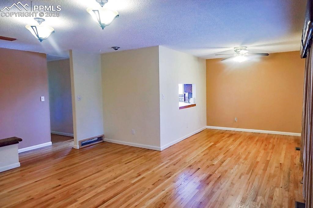 Image 11 of 50: Living Room (Looking Towards Dining Room & Kitchen Areas)