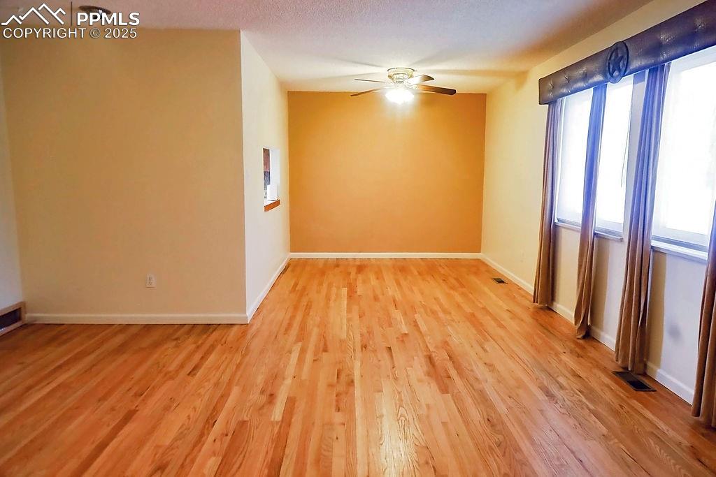 Image 12 of 50: Living Room (Looking Towards Dining Room)