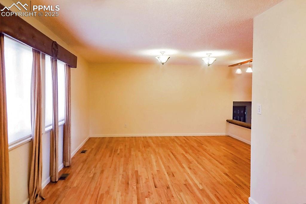 Image 13 of 50: Dining Room (Looking into Living Room)