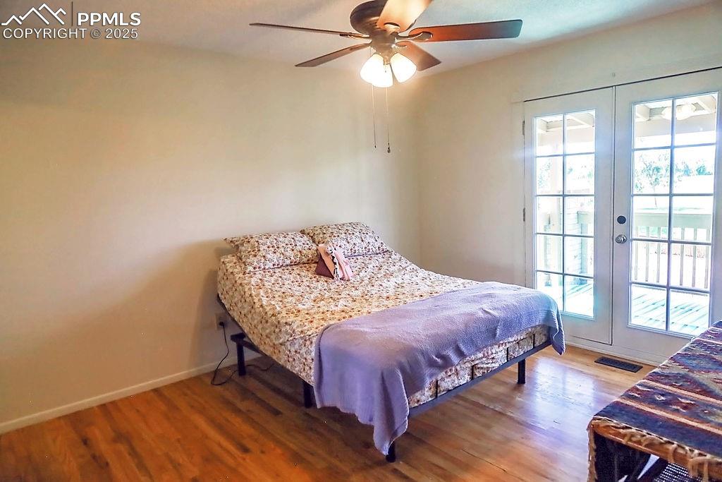Image 20 of 50: Upper Level Primary Bedroom with Ceiling Fan