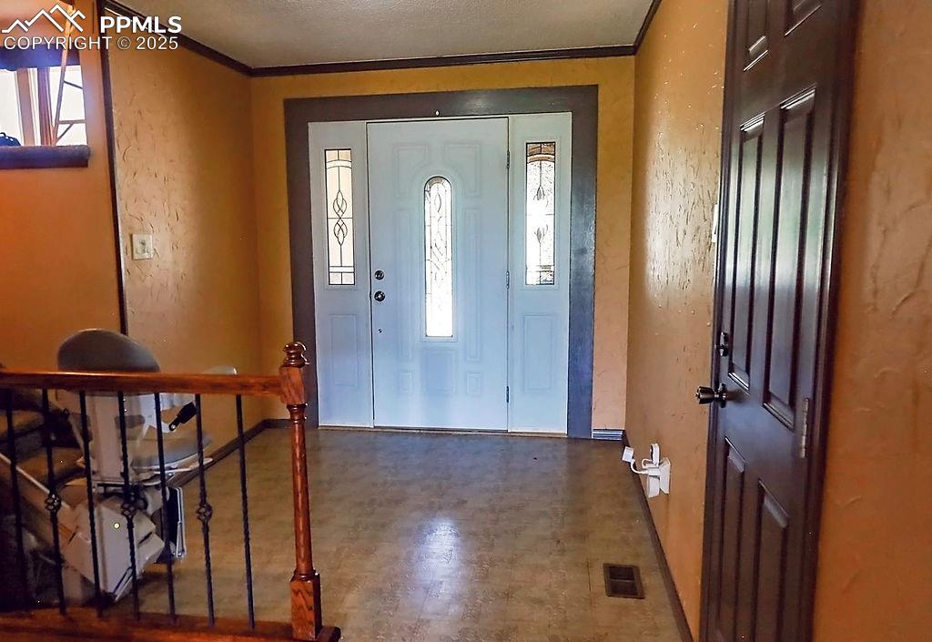 Image 4 of 50: Entry (Looking Towards Front Door, Door to Garage & Stairs)