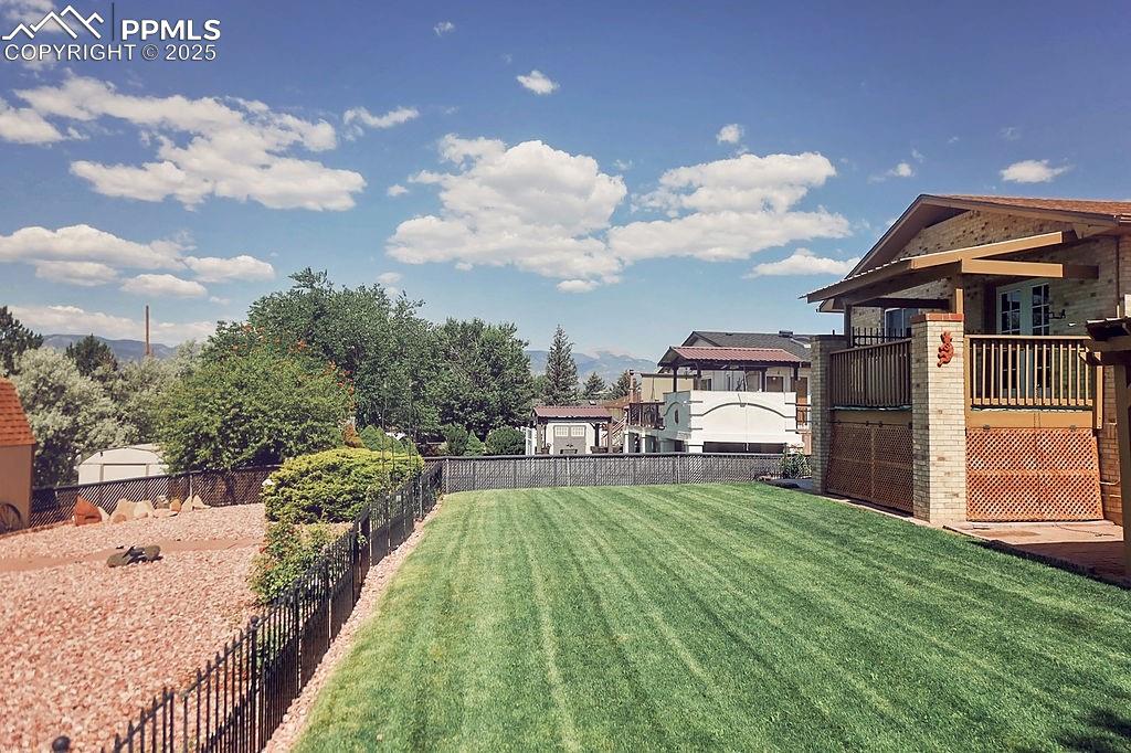 Image 44 of 50: Fully Landscaped & Fenced Backyard