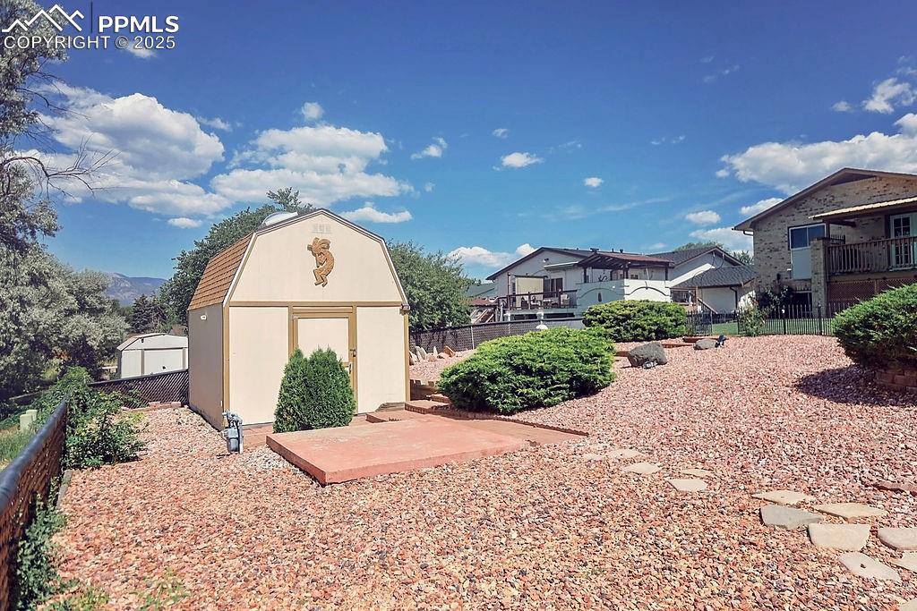 Image 48 of 50: Fully Landscaped & Fenced Backyard