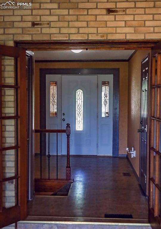 Image 5 of 50: Sun Room with French Doors (Looking Towards Entry)