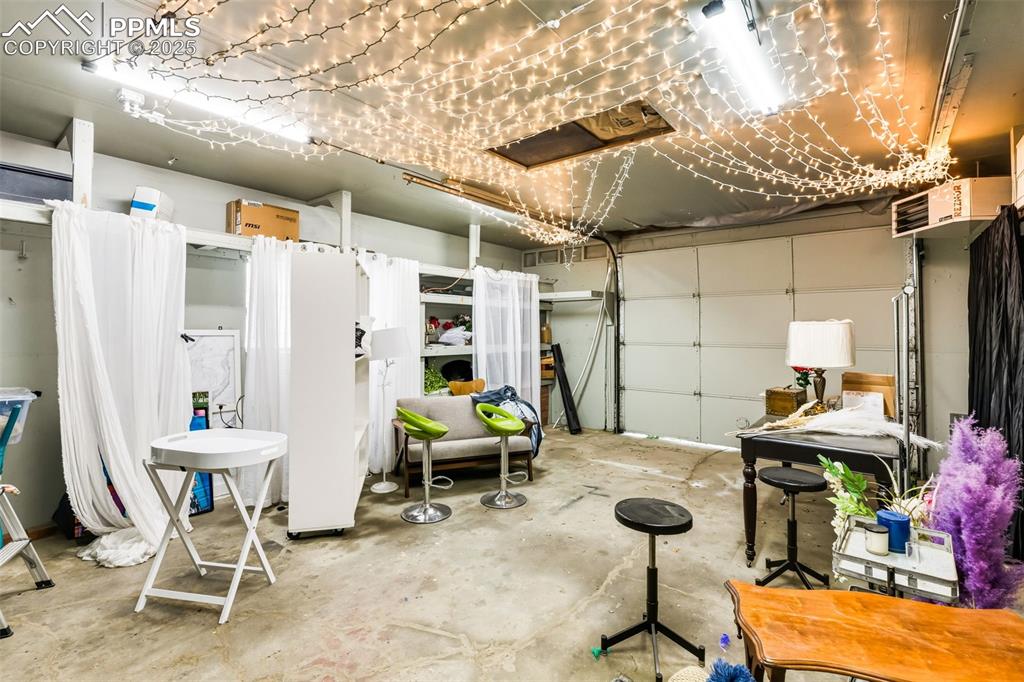 Image 21 of 26: detached garage was used as a photography studio, does have an garage door 