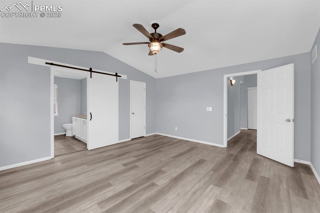 Image 13 of 36: Master Bedroom with Walk-In Closet