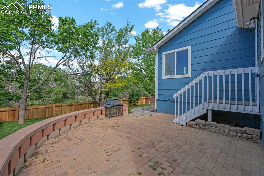 Image 29 of 36: Patio with outdoor fire area