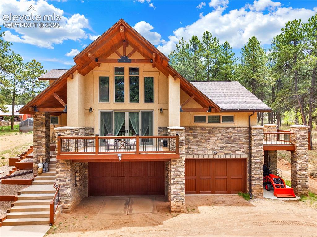 Image 1 of 43: Beautiful front drive situated right in the middle of 5 wooded acres