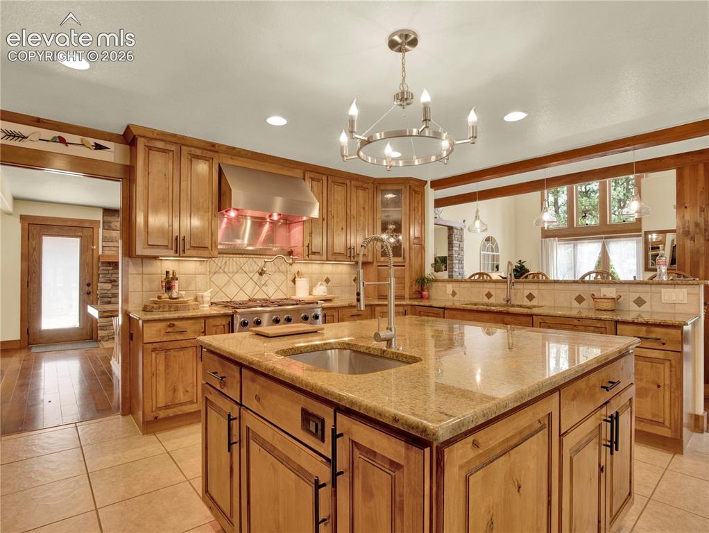 Image 10 of 43: The kitchen island is complete with a secondary sink