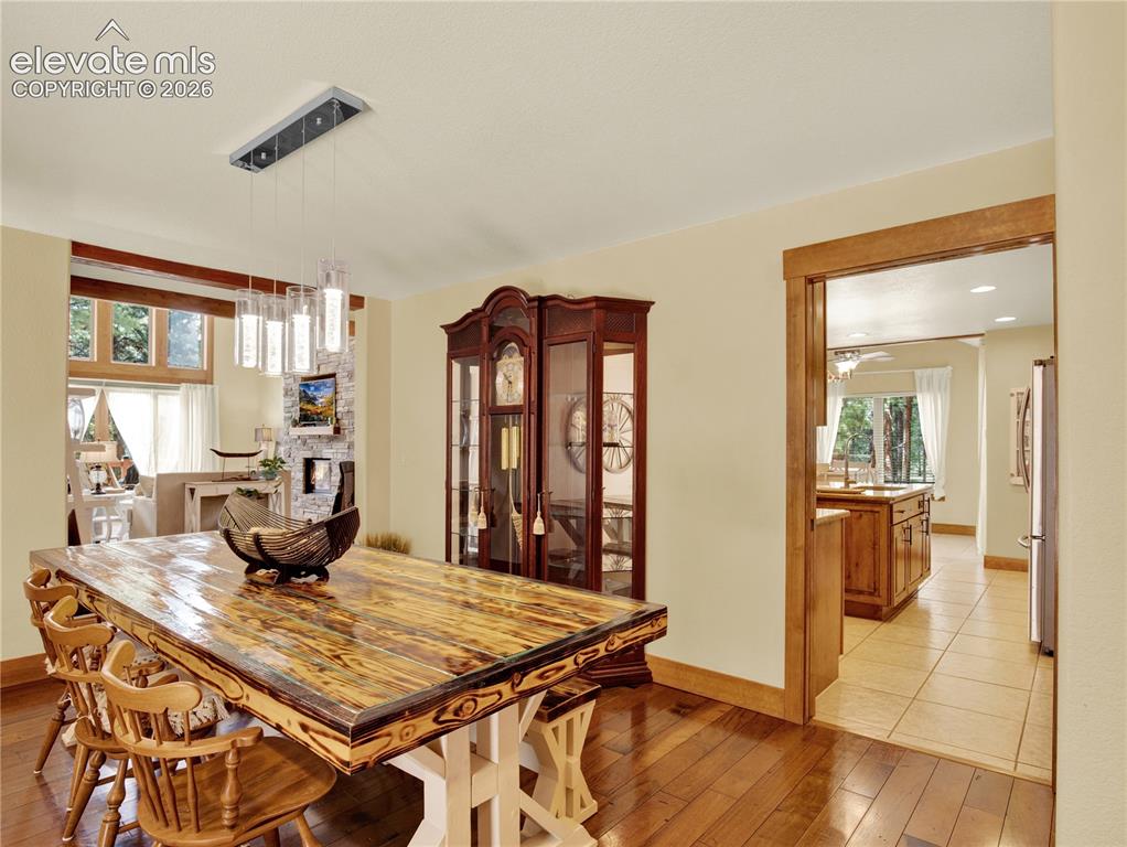 Image 15 of 43: Formal dining separated by a pocket door from the kitchen
