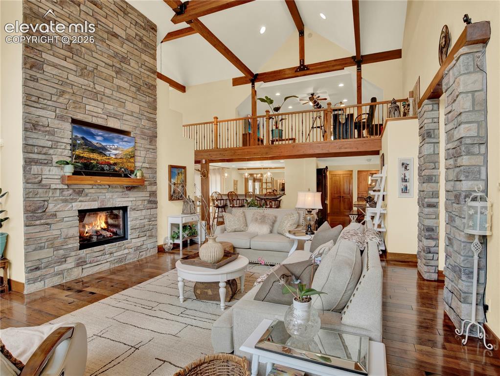 Image 3 of 43: Living room with high vaulted ceiling