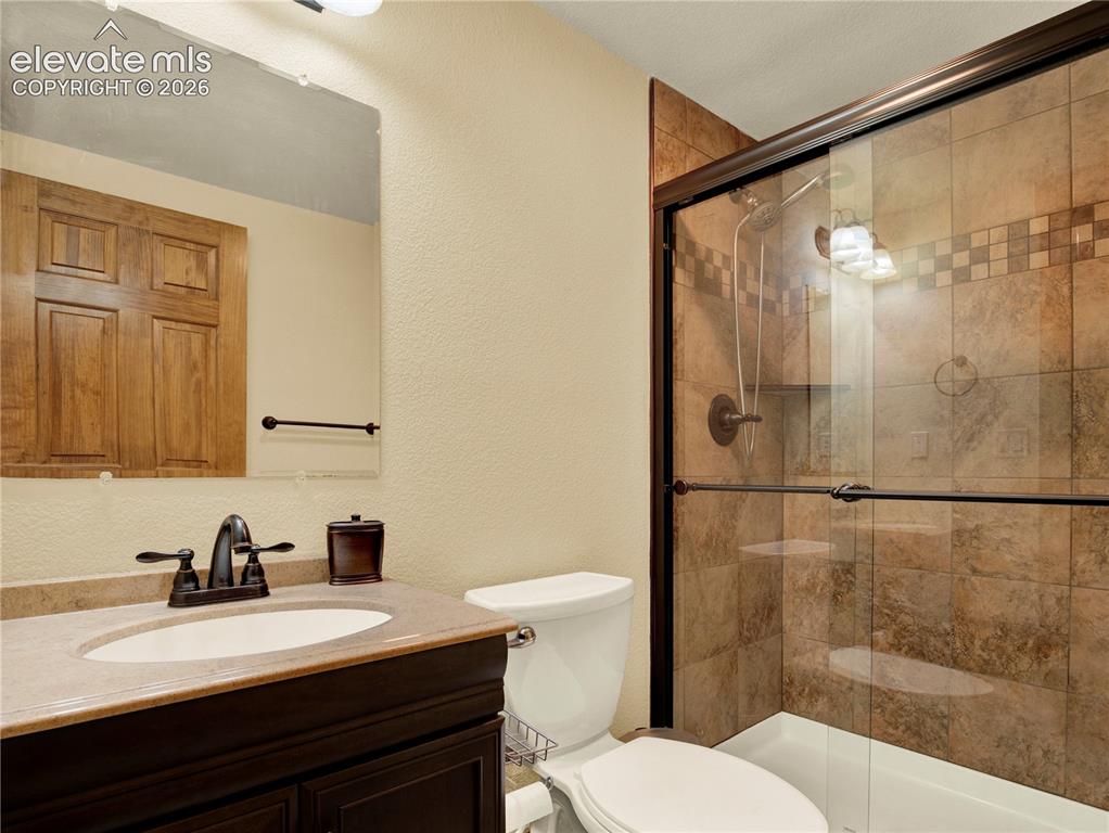 Image 33 of 43: Basement bathroom located off of bar area