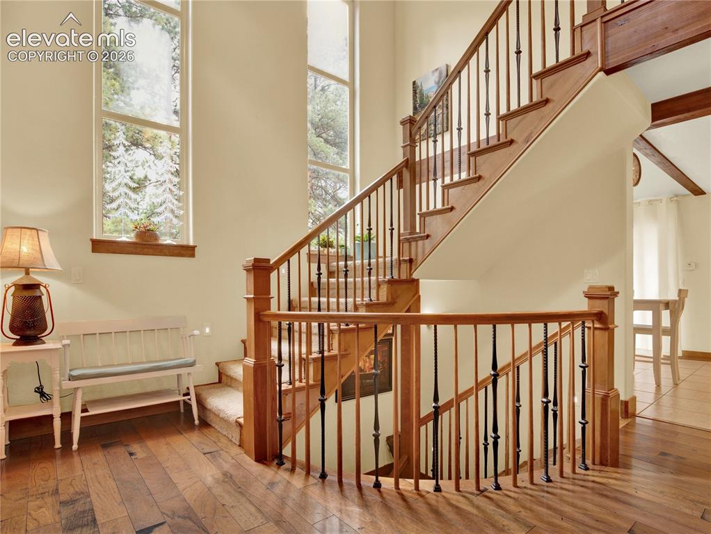 Image 5 of 43: Greeted from the front door to a beautiful stair case