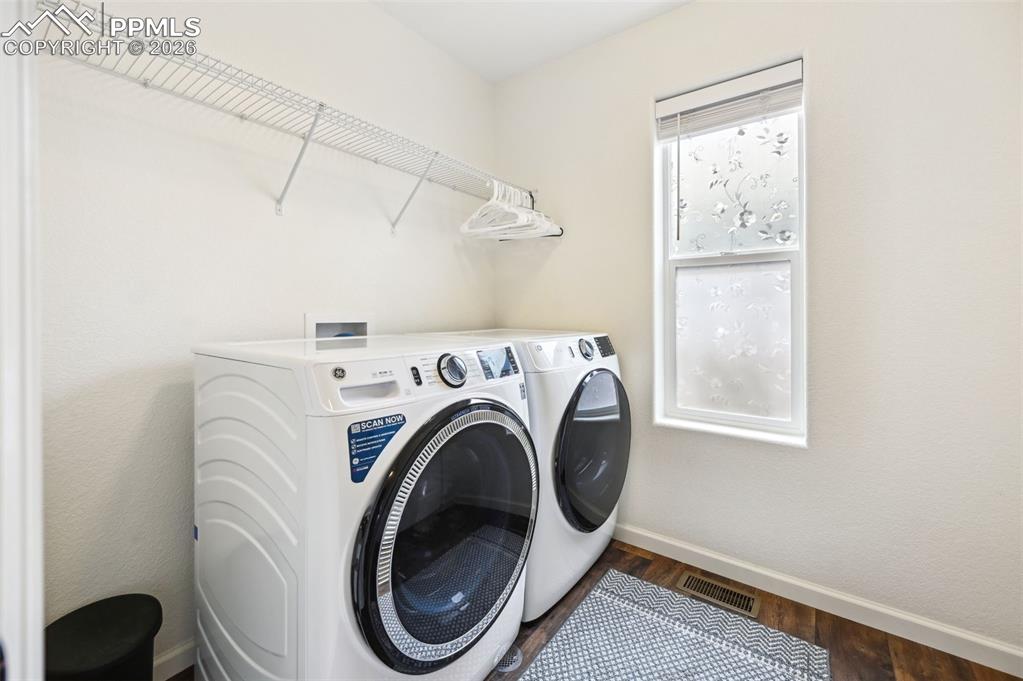 Image 27 of 33: large upstairs laundry room with additional storage