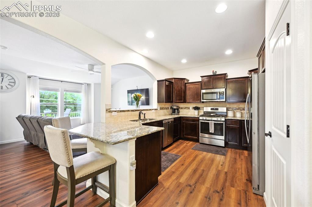 Image 9 of 33: kitchen opens up nicely to the living room and dining area