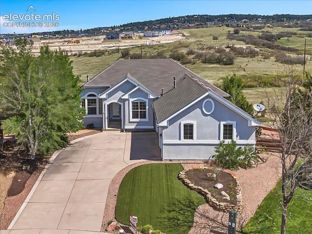 Image 37 of 50: Attractive stucco exterior with new exterior paint, mature landscaping, an