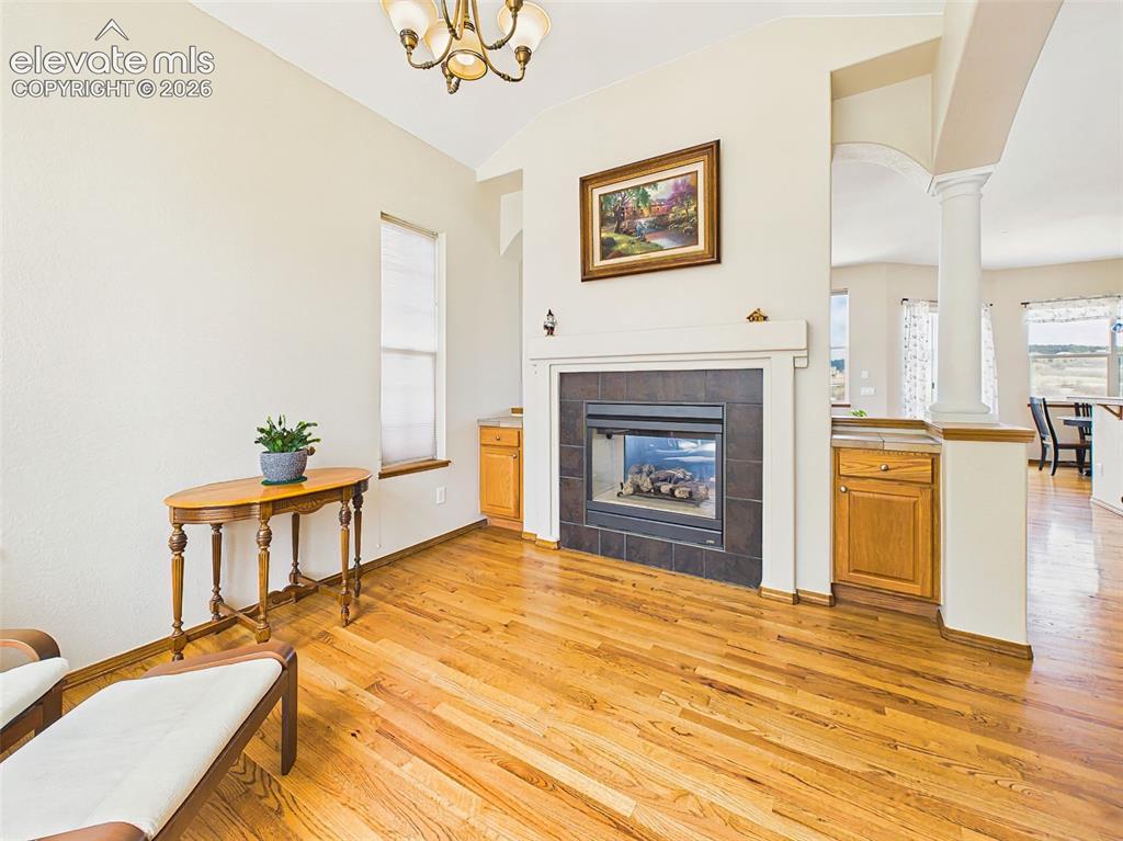 Image 5 of 50: Cozy formal dining space centered around a 2 sided gas fireplace with abund