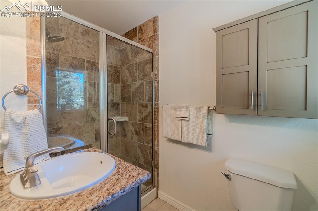 Image 18 of 50: Primary Bathroom with a shower stall and vanity