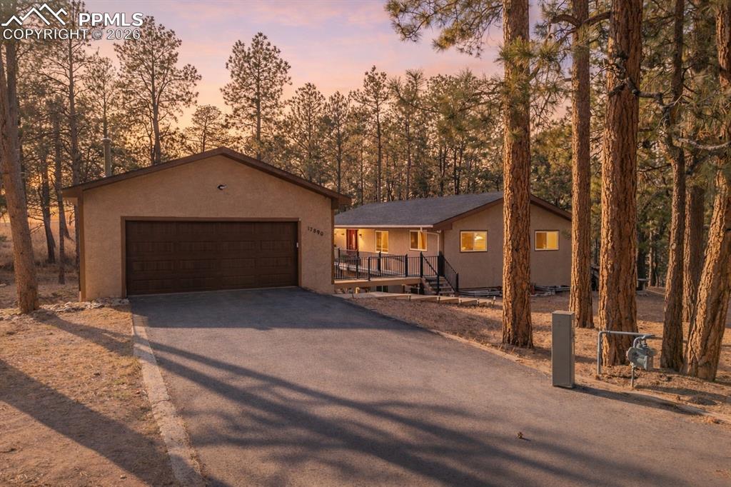 Image 4 of 50: View of front of property featuring a 2 car garage, with sealed driveway