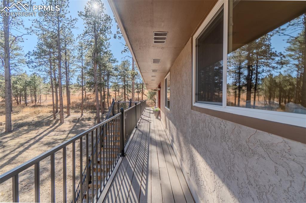 Image 44 of 50: Covered walkway to front door 