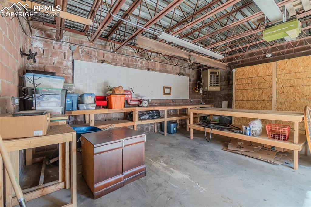 Image 45 of 50: Three car garage currently used as a workshop *Heated* 