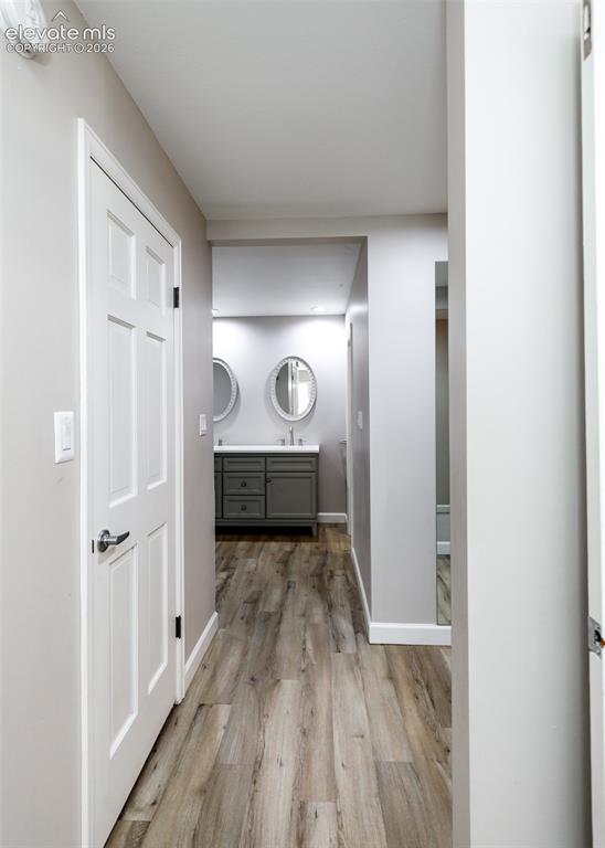 Image 27 of 50: Wood-finish flooring throughout, with light gray painted walls