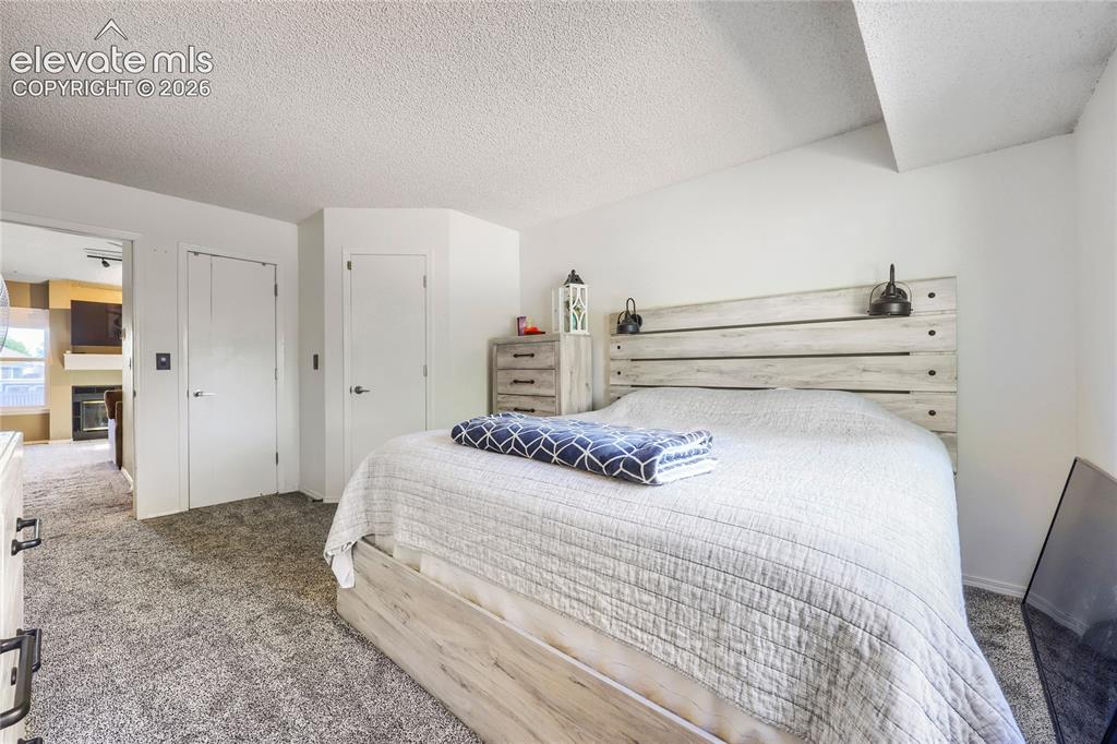 Image 14 of 19: Plush carpeting with a neutral palette