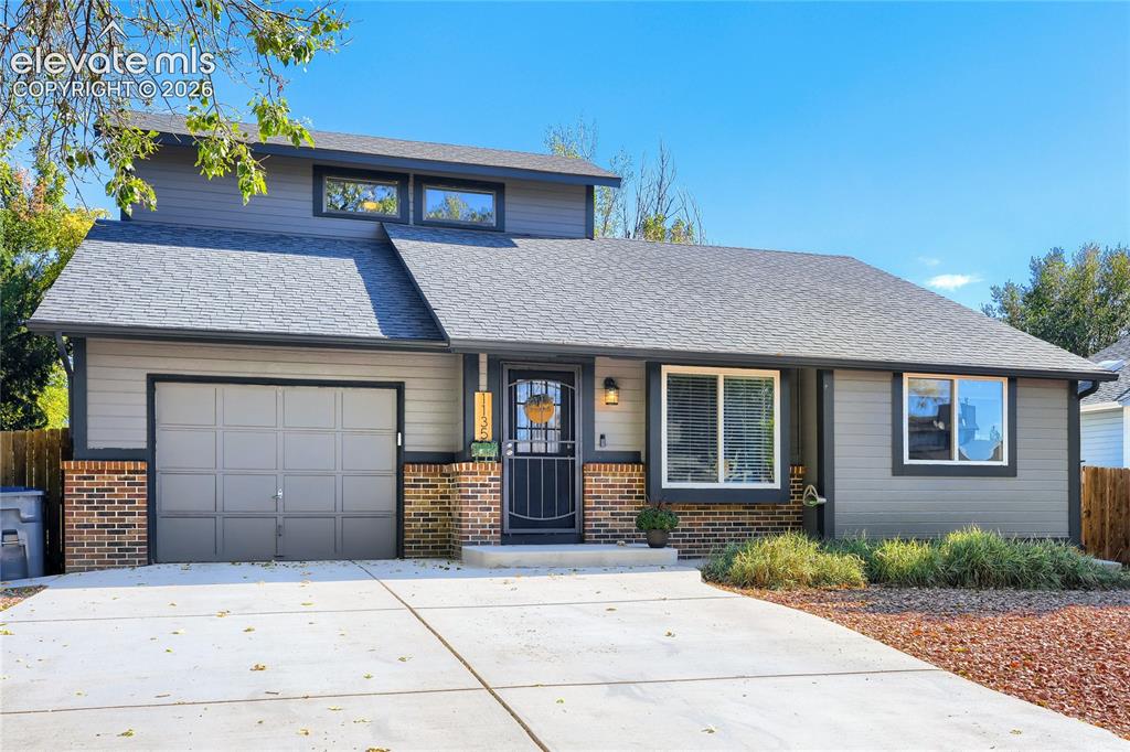 Image 3 of 19: Exterior featuring gray siding, a dark gray asphalt shingle roof, a single-
