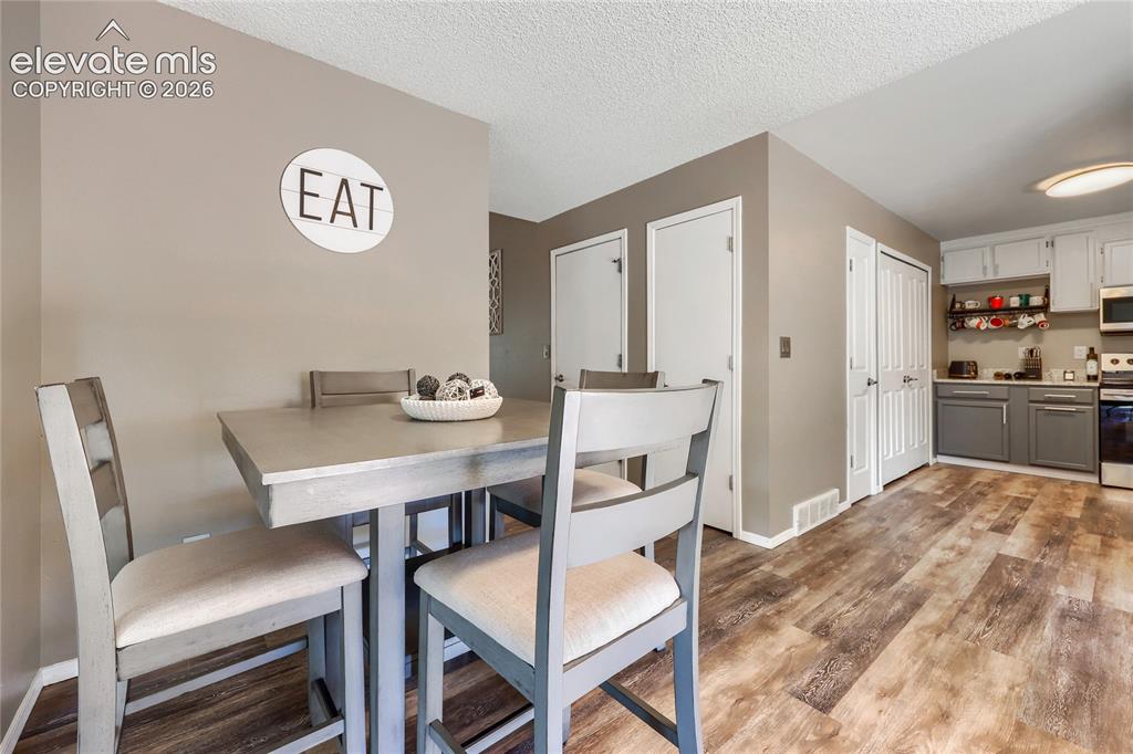Image 9 of 19: Wood-finish flooring throughout, with a neutral wall palette