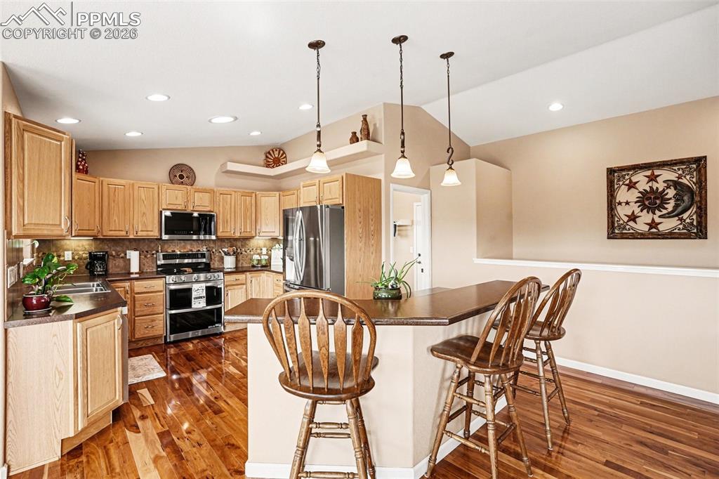 Image 12 of 47: The kitchen features an open-concept layout perfect for entertaining and ev