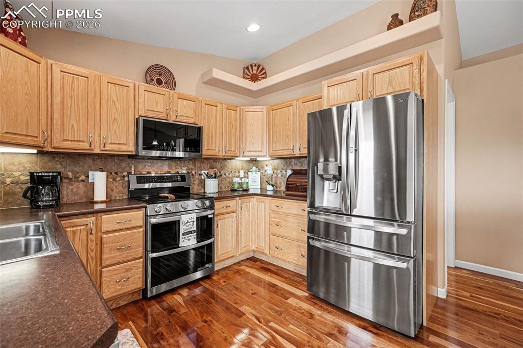 Image 13 of 47: The kitchen features an open-concept layout perfect for entertaining and ev