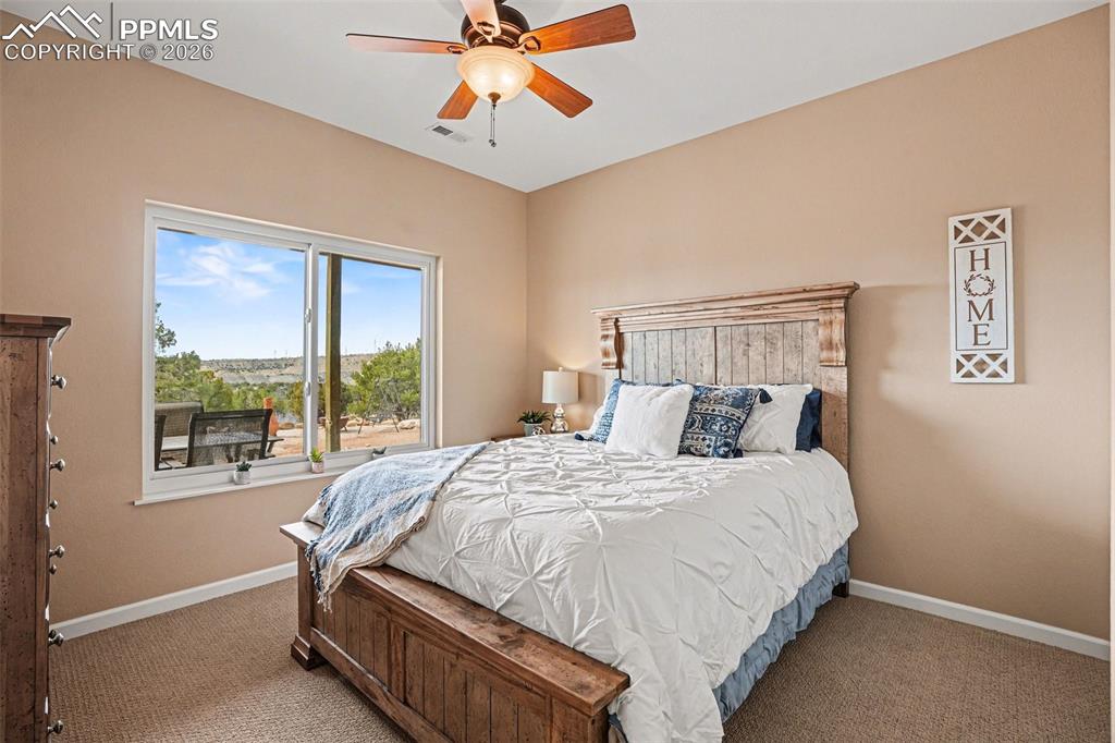 Image 27 of 47: The 1st basement bedroom is spacious and versatile, featuring ample natural