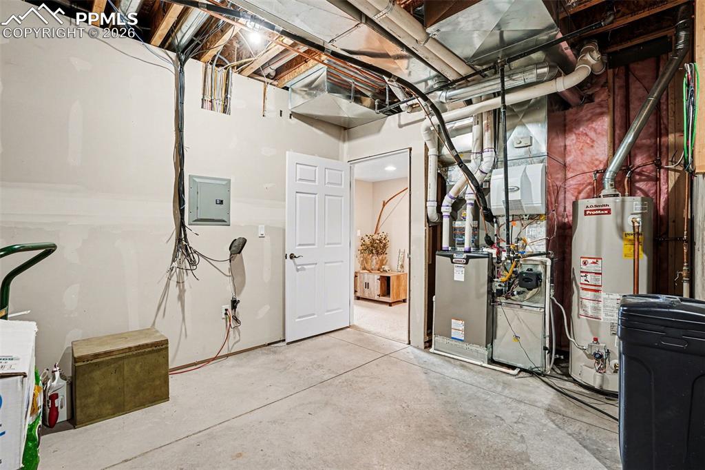 Image 30 of 47: The mechanical/storage room in the basement is spacious and functional, pro