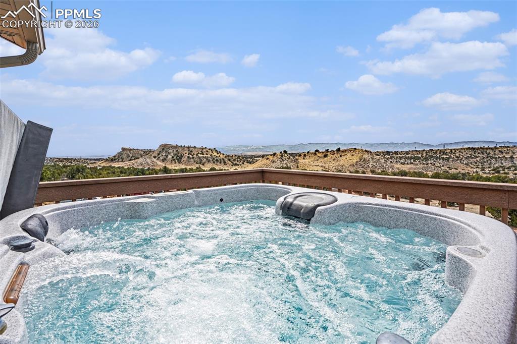 Image 32 of 47: The upstairs Trex deck is perfect for relaxation and entertaining, featurin