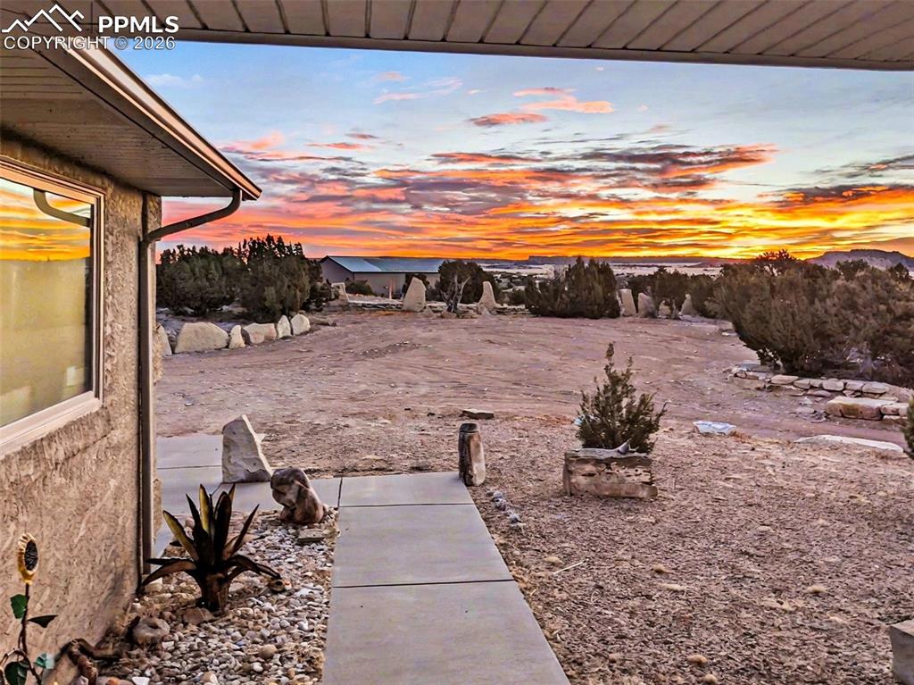 Image 36 of 47: Enjoy breathtaking Colorado sunsets from the Trex deck, hot tub, and back p