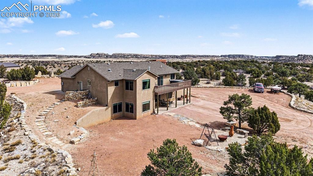 Image 38 of 47: Enjoy breathtaking Colorado sunsets from the Trex deck, hot tub, and back p