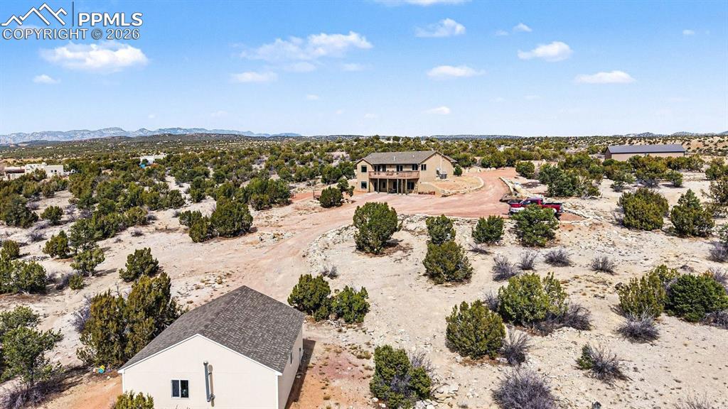 Image 40 of 47: From an aerial perspective, the nearly 40-acre property showcases the custo