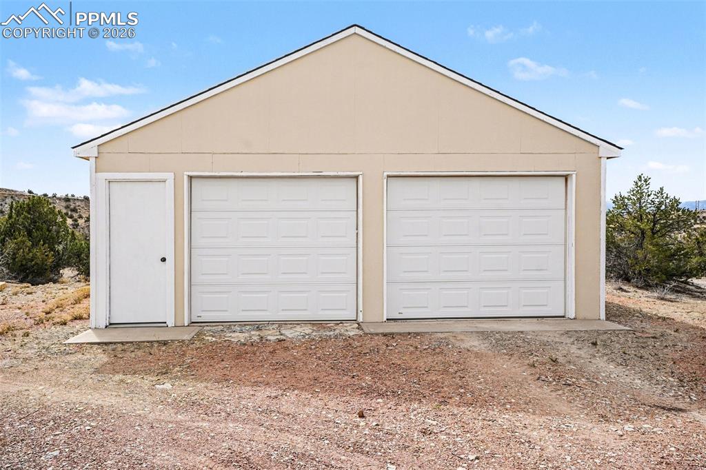 Image 41 of 47: The detached 2-car heated garage/shop is fully equipped with water, electri