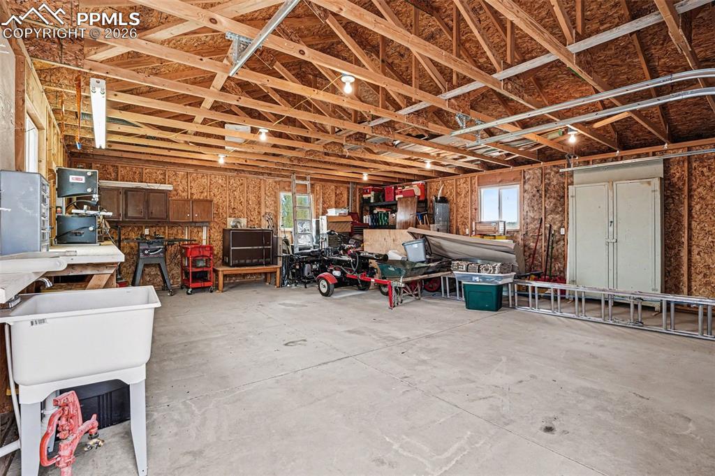 Image 42 of 47: The detached 2-car heated garage/shop is fully equipped with water, electri