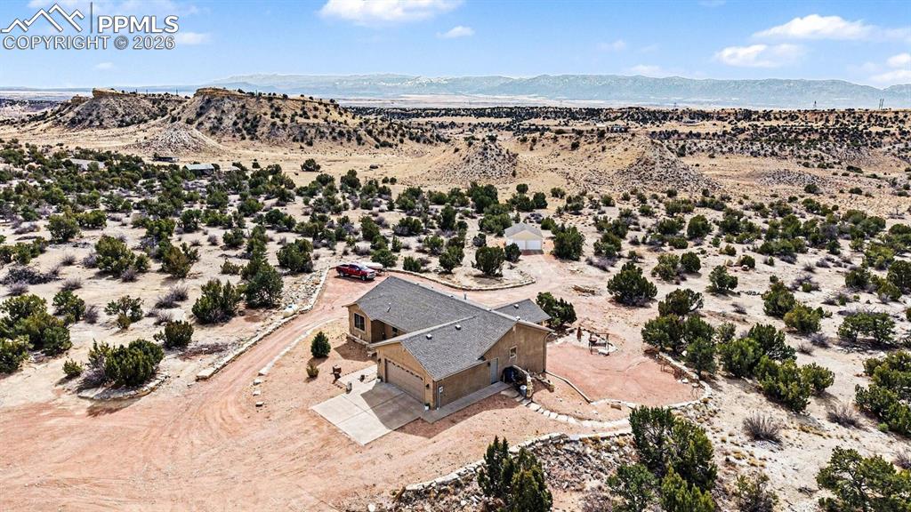 Image 44 of 47: From an aerial perspective, the nearly 40-acre property showcases the custo