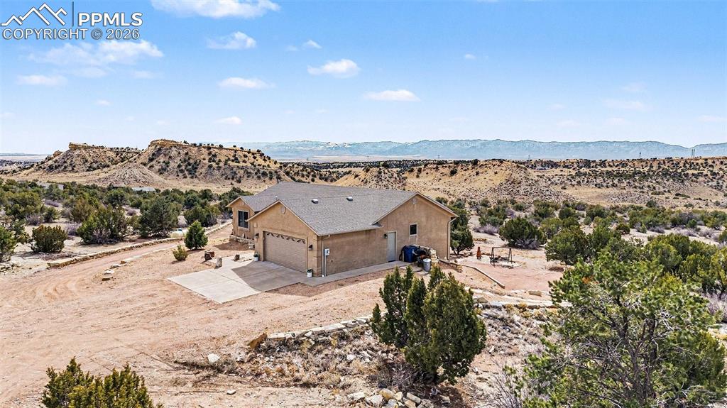 Image 5 of 47: property showcases nearly 40 acres of open land, with the custom stucco ran