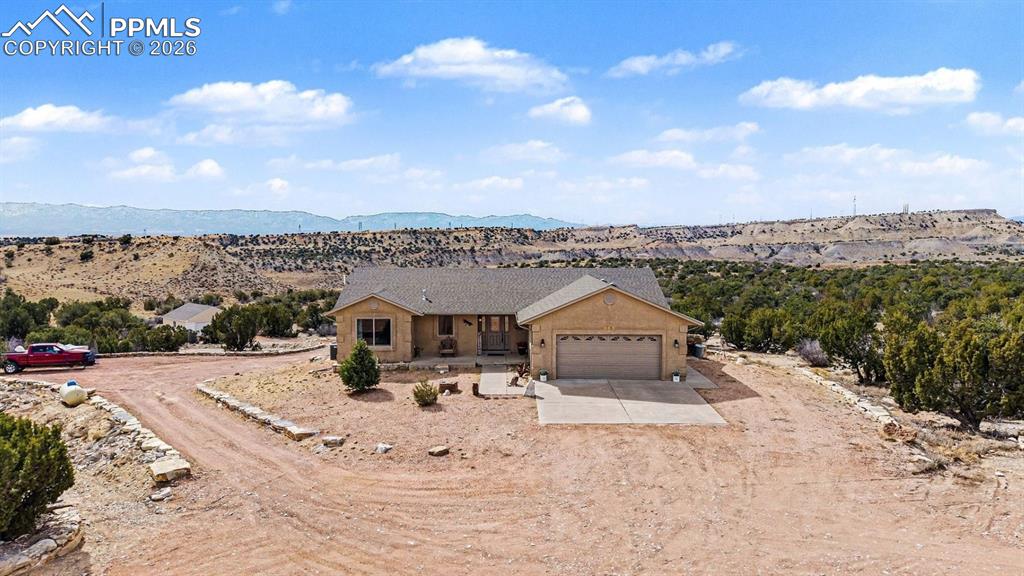 Image 6 of 47: property showcases nearly 40 acres of open land, with the custom stucco ran
