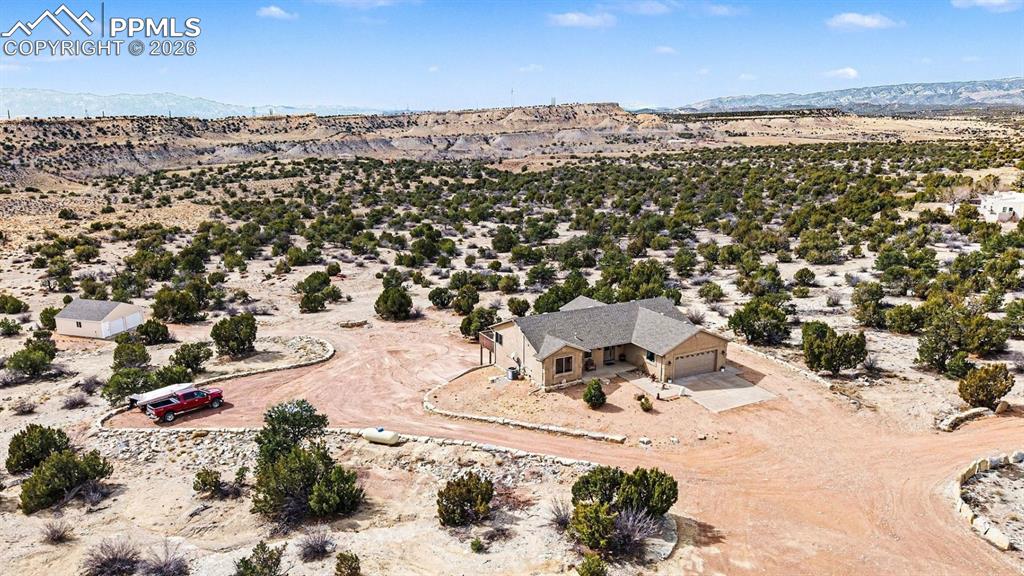 Image 7 of 47: property showcases nearly 40 acres of open land, with the custom stucco ran