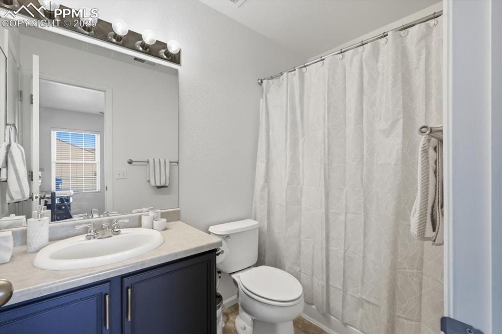 Image 25 of 36: Full bathroom featuring vanity and curtained shower