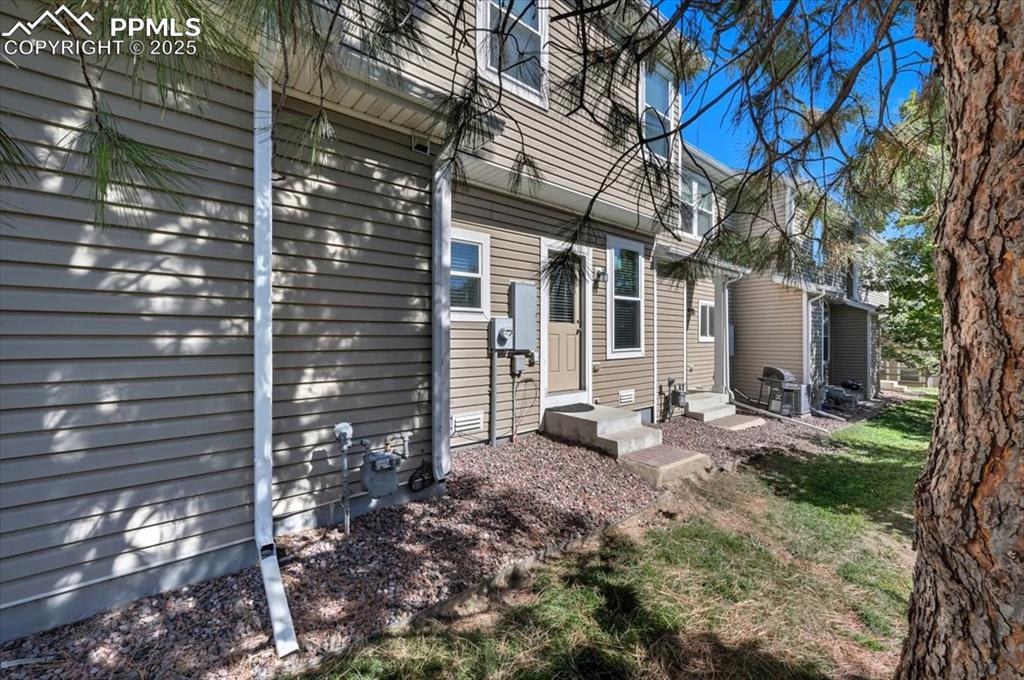 Image 28 of 36: View of side of home