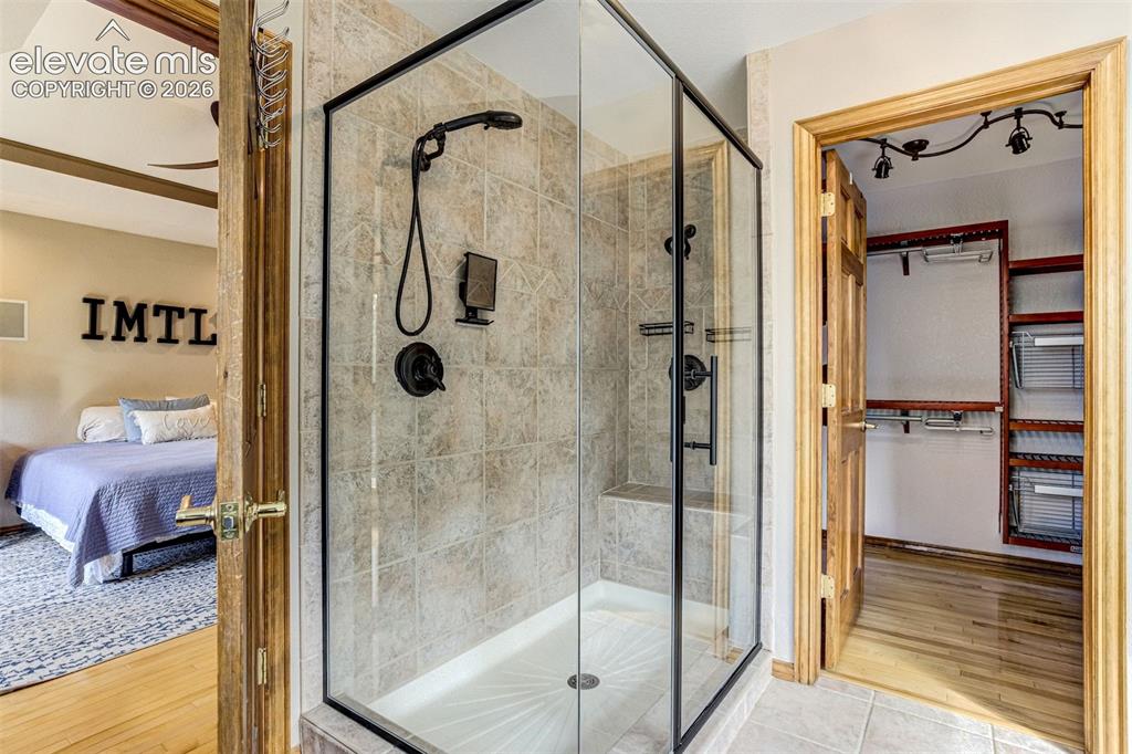 Image 22 of 40: Primary Bathroom Suite Featuring a Frameless Glass Enclosure Shower with Du