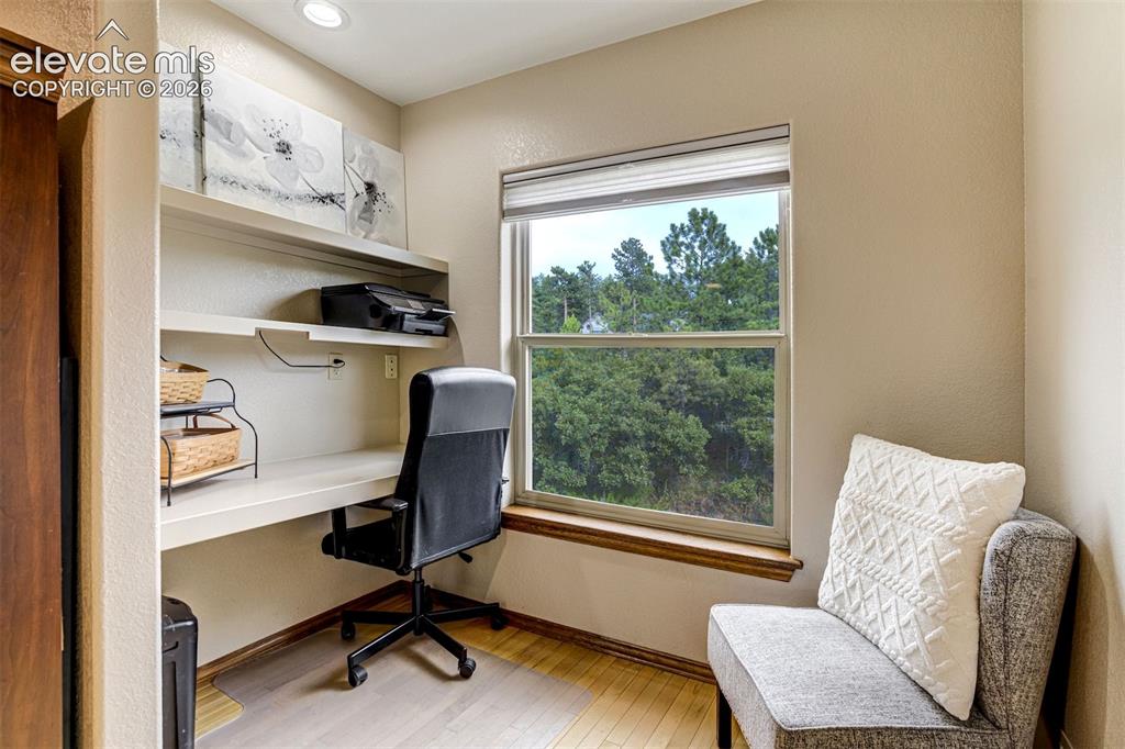 Image 26 of 40: Desk area in secondary bedroom on upper level