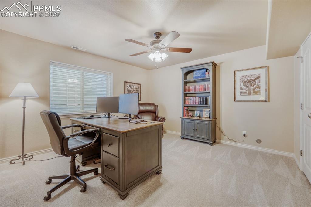 Image 34 of 50: Basement Bedroom #2 Currently used as an office.